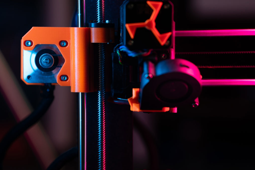 A detailed view of a 3D printer's components.