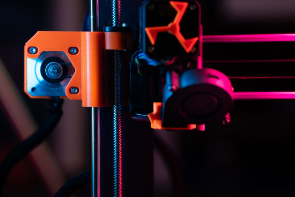 A detailed view of a 3D printer's components.