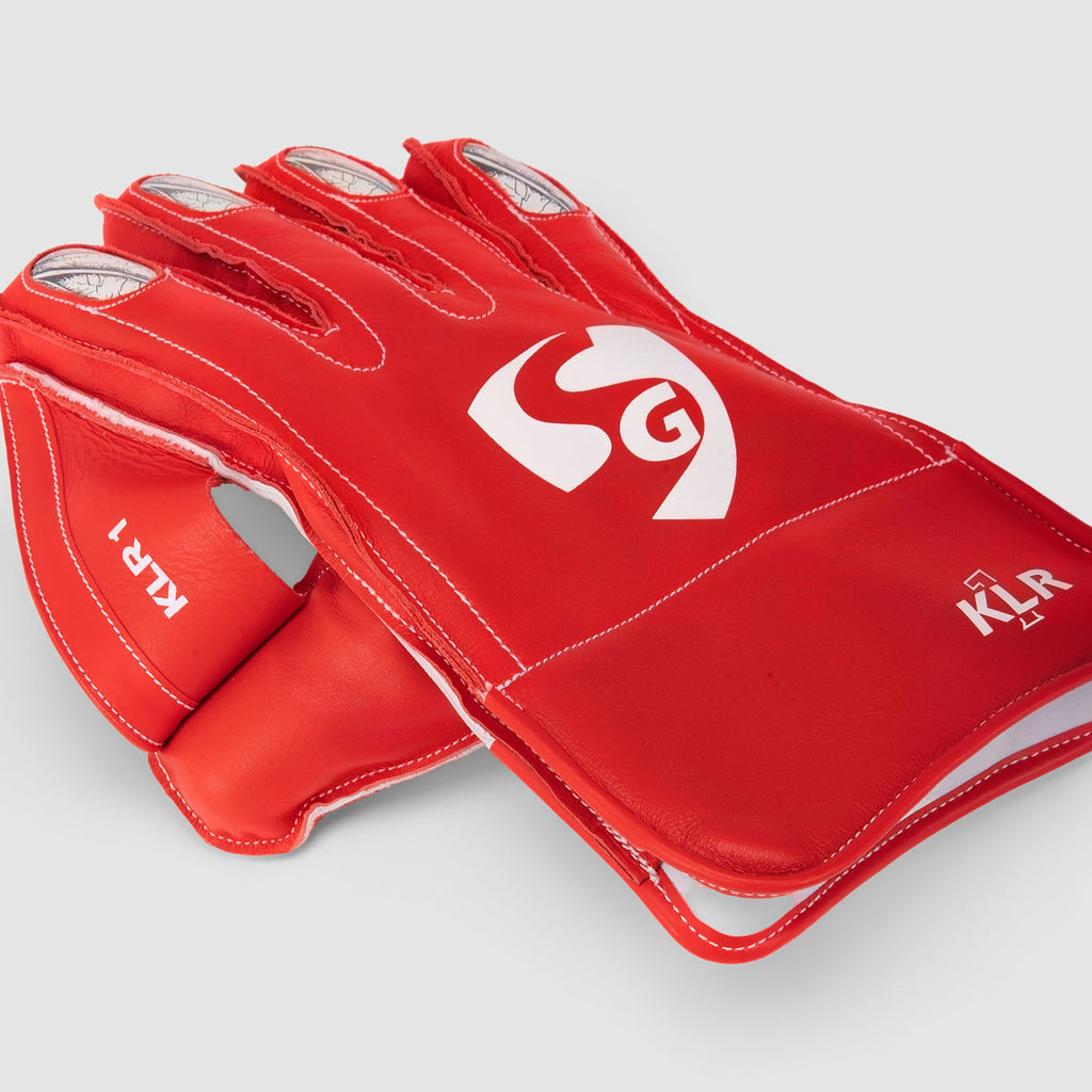 SG KLR 1 Blue/Red wicketkeeping gloves, leather and cuff detail